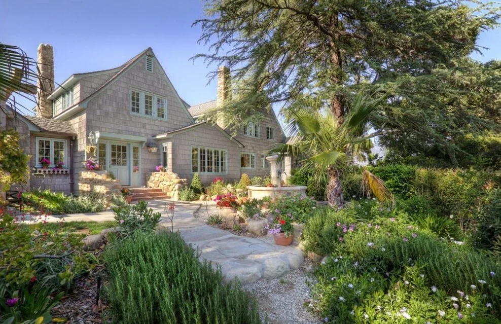 Shingle-style home exterior repainted from dark brown to warm gray — after