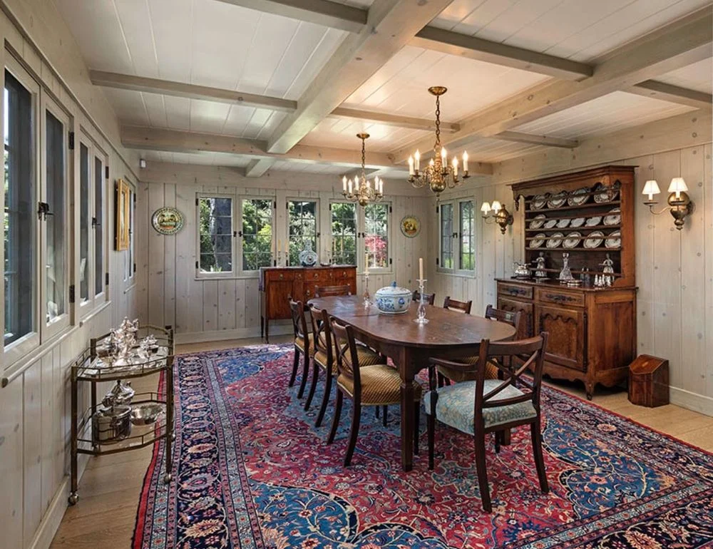Knotty pine dining room repainted to a light whitewashed finish — after
