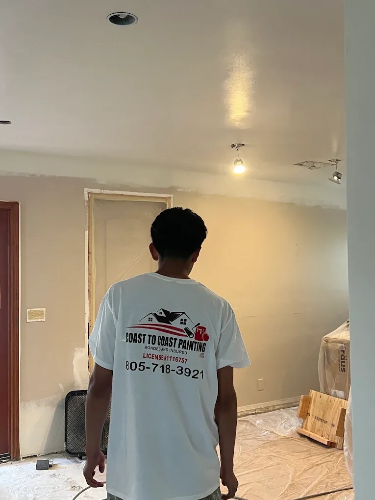 Coast To Coast Painting crew member at work on an interior painting project