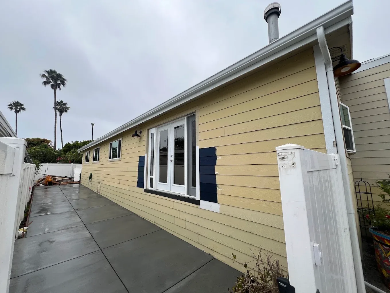 Exterior house painting in progress in Oxnard, CA