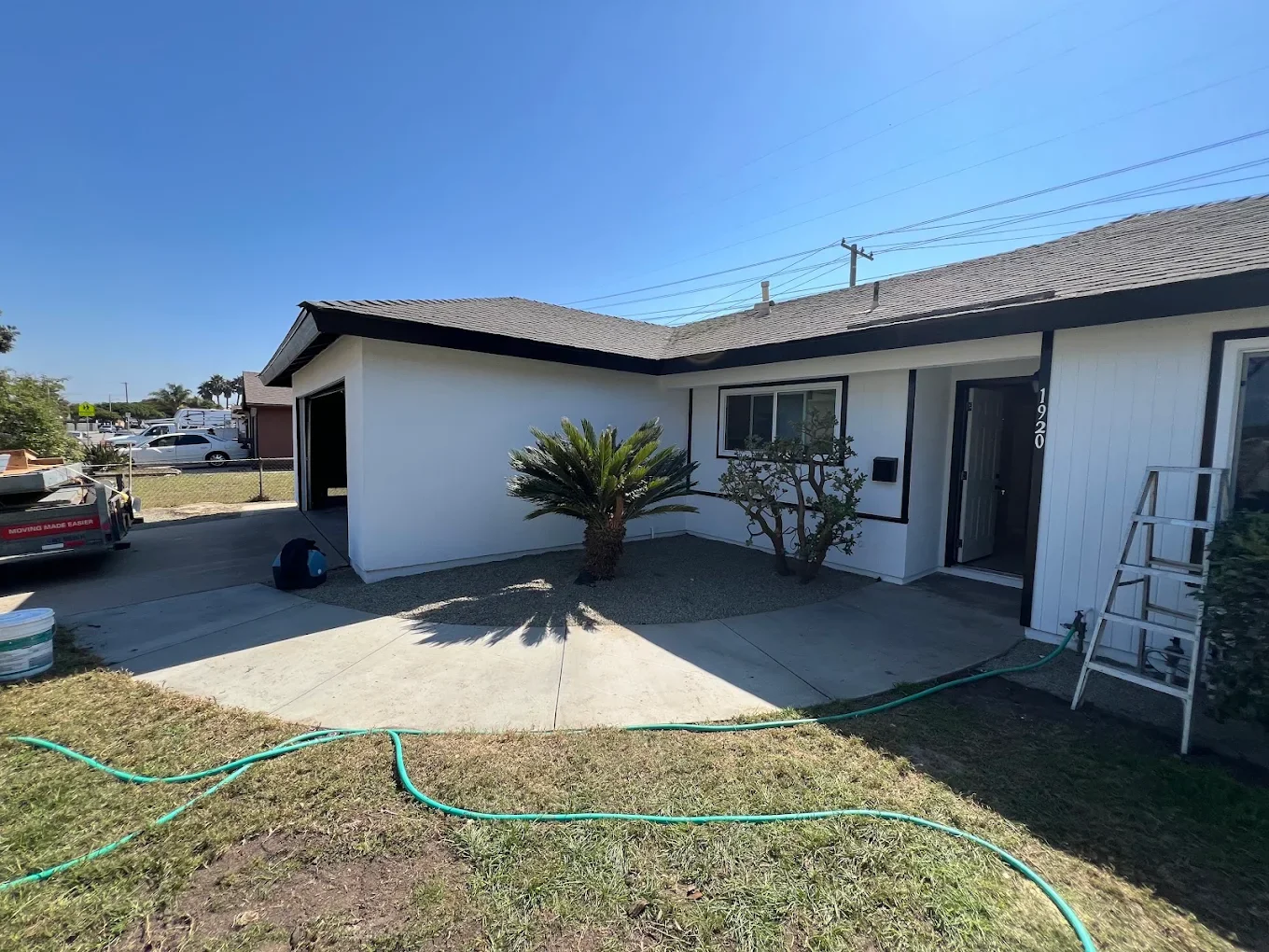 White ranch house exterior, finished